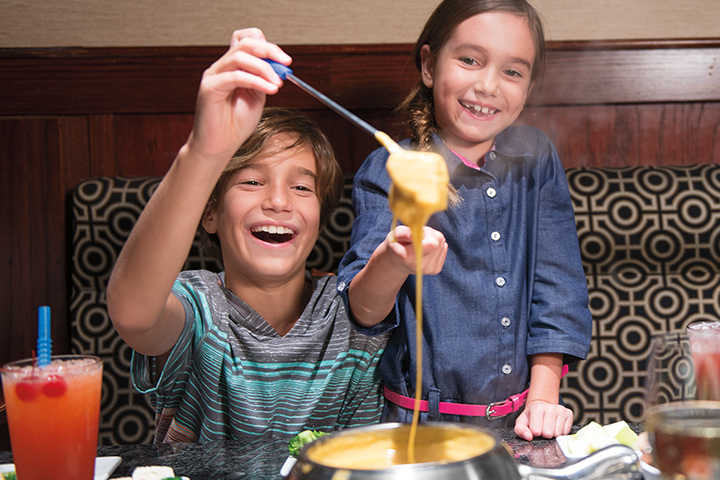 Kids having fun with fondue