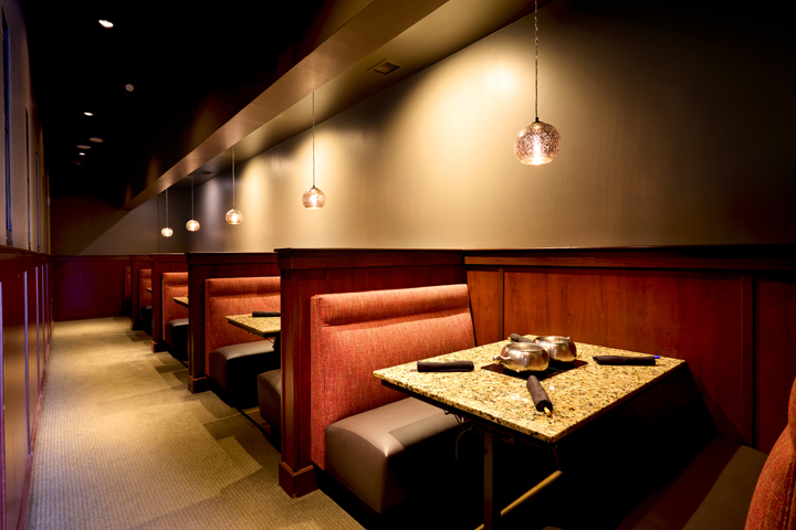 a table with a marble top and a few chairs