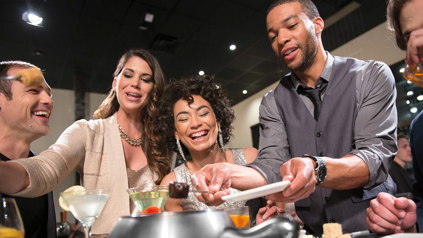 Friends Enjoying Fondue at The Melting Pot