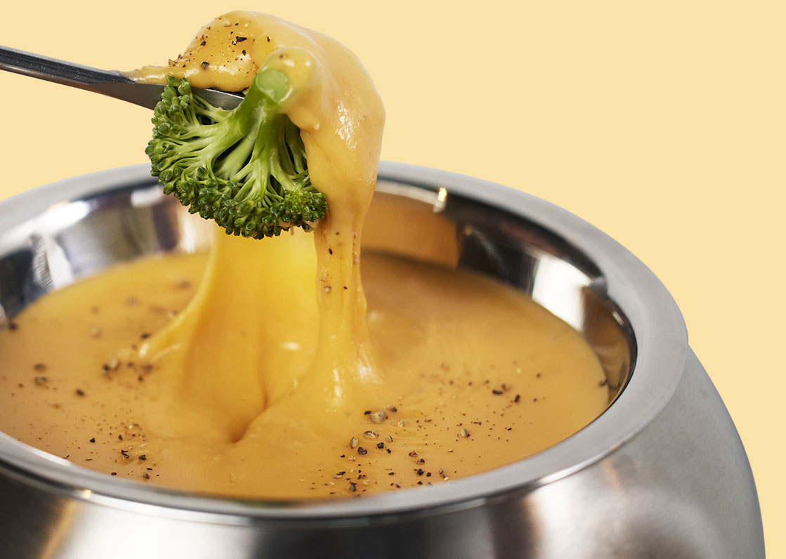 Broccolli Dipped in Cheddar Cheese Fondue