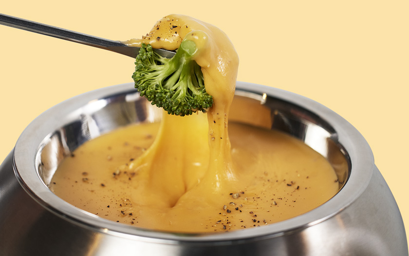 Broccolli Dipped in Cheddar Cheese Fondue