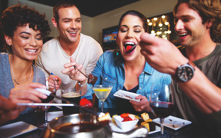 Friends Enjoying Chocolate Fondue at Melting Pot