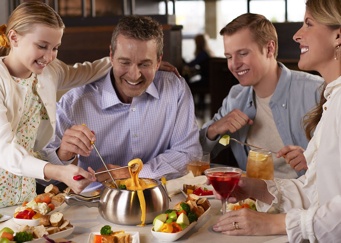 Family Enjoying Chocolate Fondue at Melting Pot