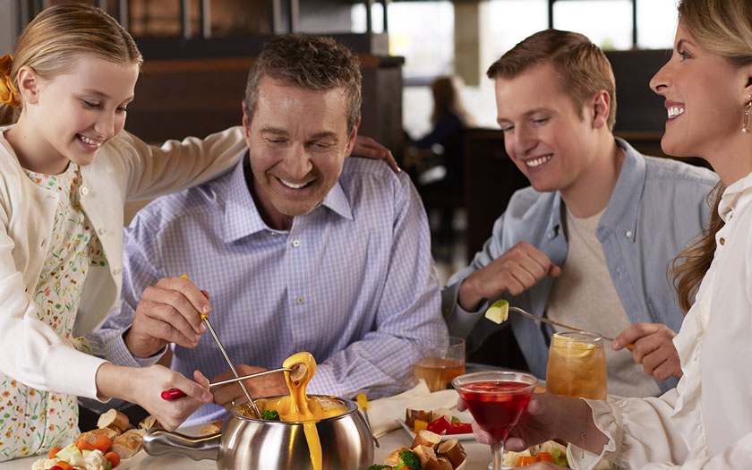 Family Enjoying Chocolate Fondue at Melting Pot