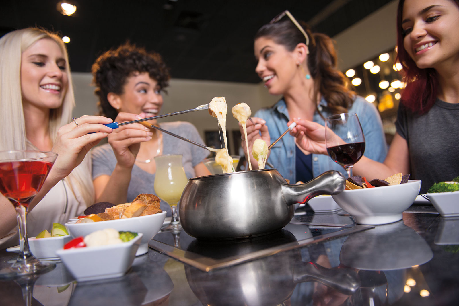 Friends Enjoying Cheese Fondue