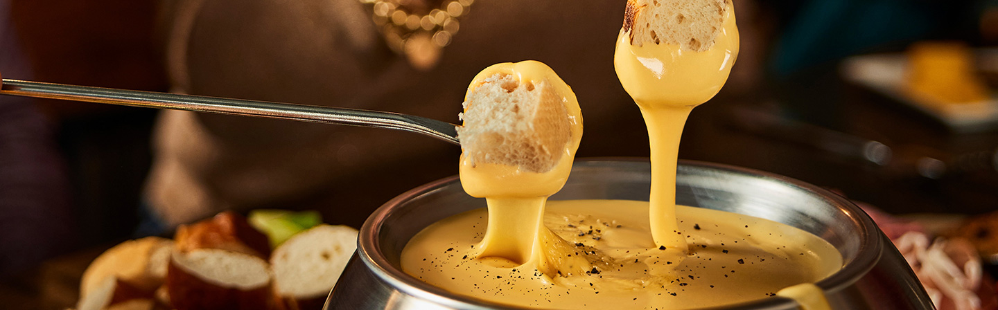 Bread Dipped in Cheese Fondue