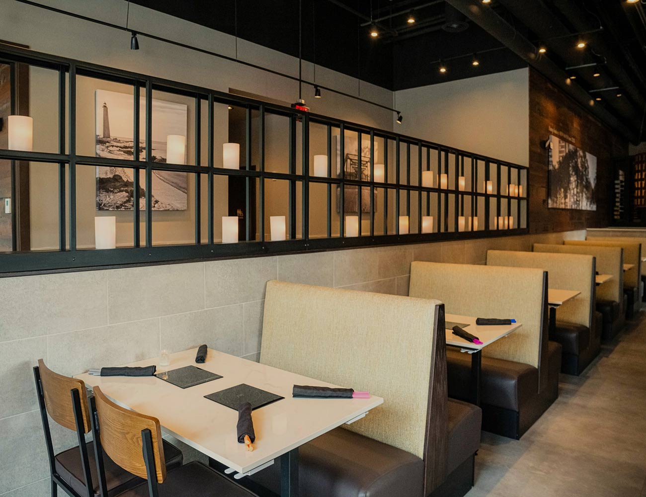 A private and cozy dining booth with warm lighting at Melting Pot in New Haven