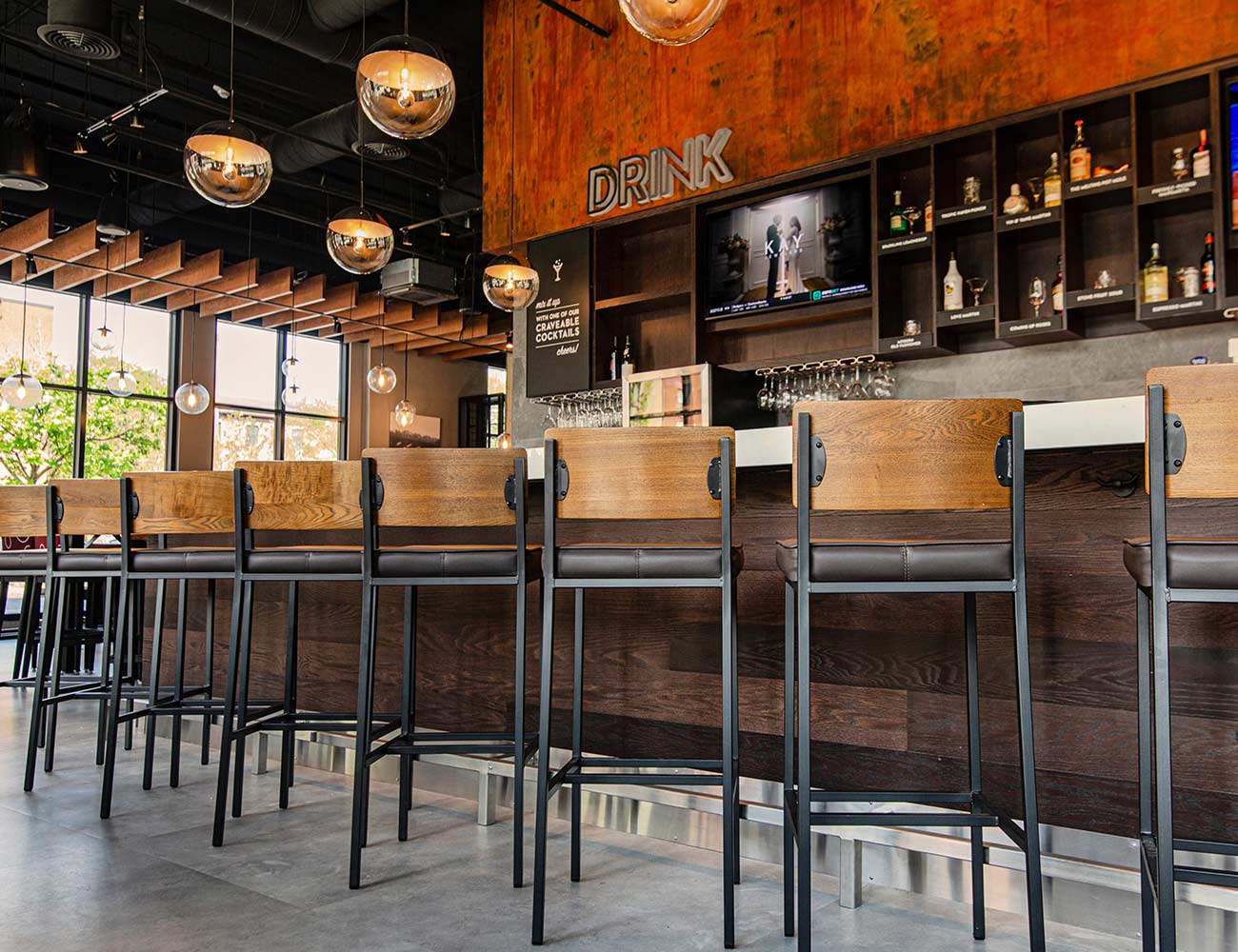 A modern social bar area at Melting Pot in New Haven, CT.
