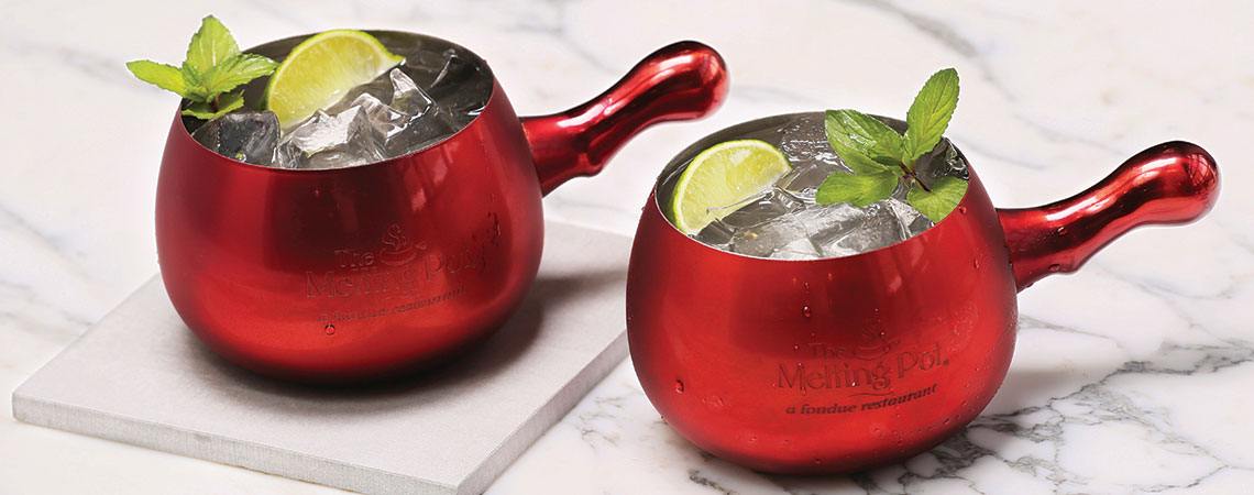 Red Mule mugs on table