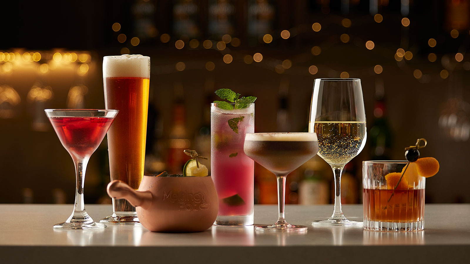 Some Melting Pot beverage options on a bar