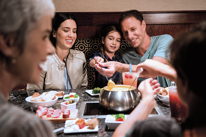 family eating fondue