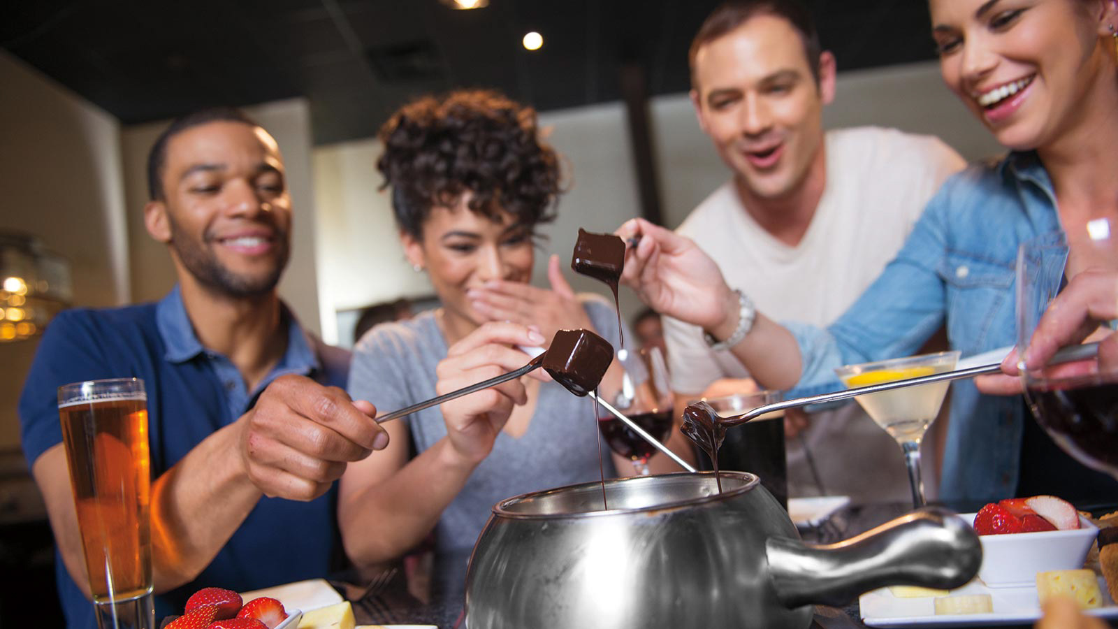 Group of Friends Enjoying Fondue