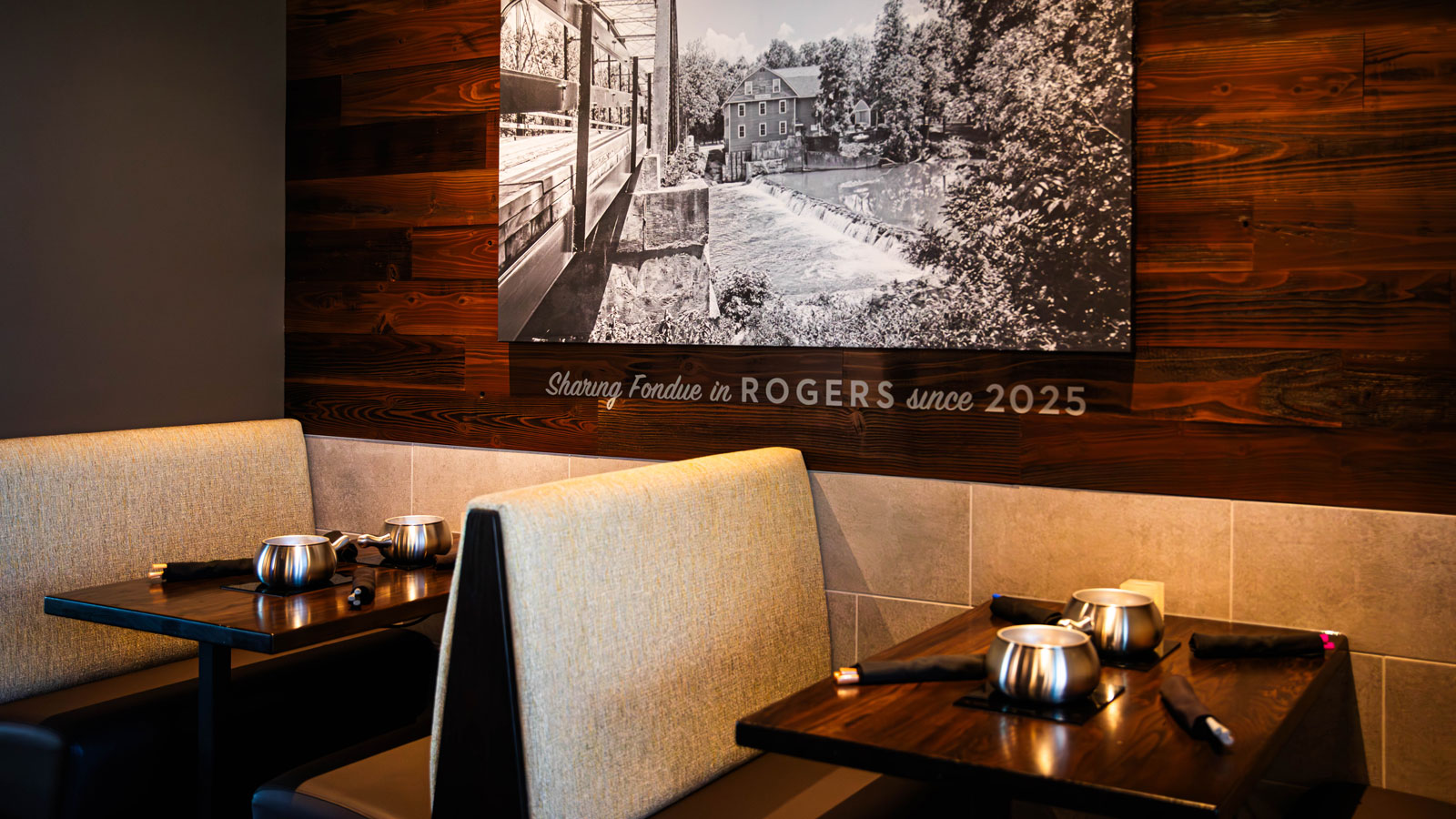 a table with a picture of a house and a painting on the wall